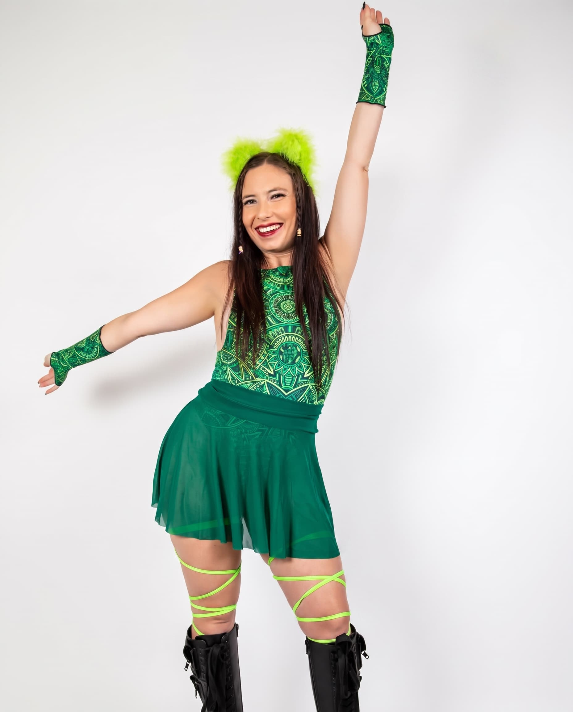 Emerald Mesh Skater Skirt, front view on model with one arm raised, showing sheer green fabric and flared hem