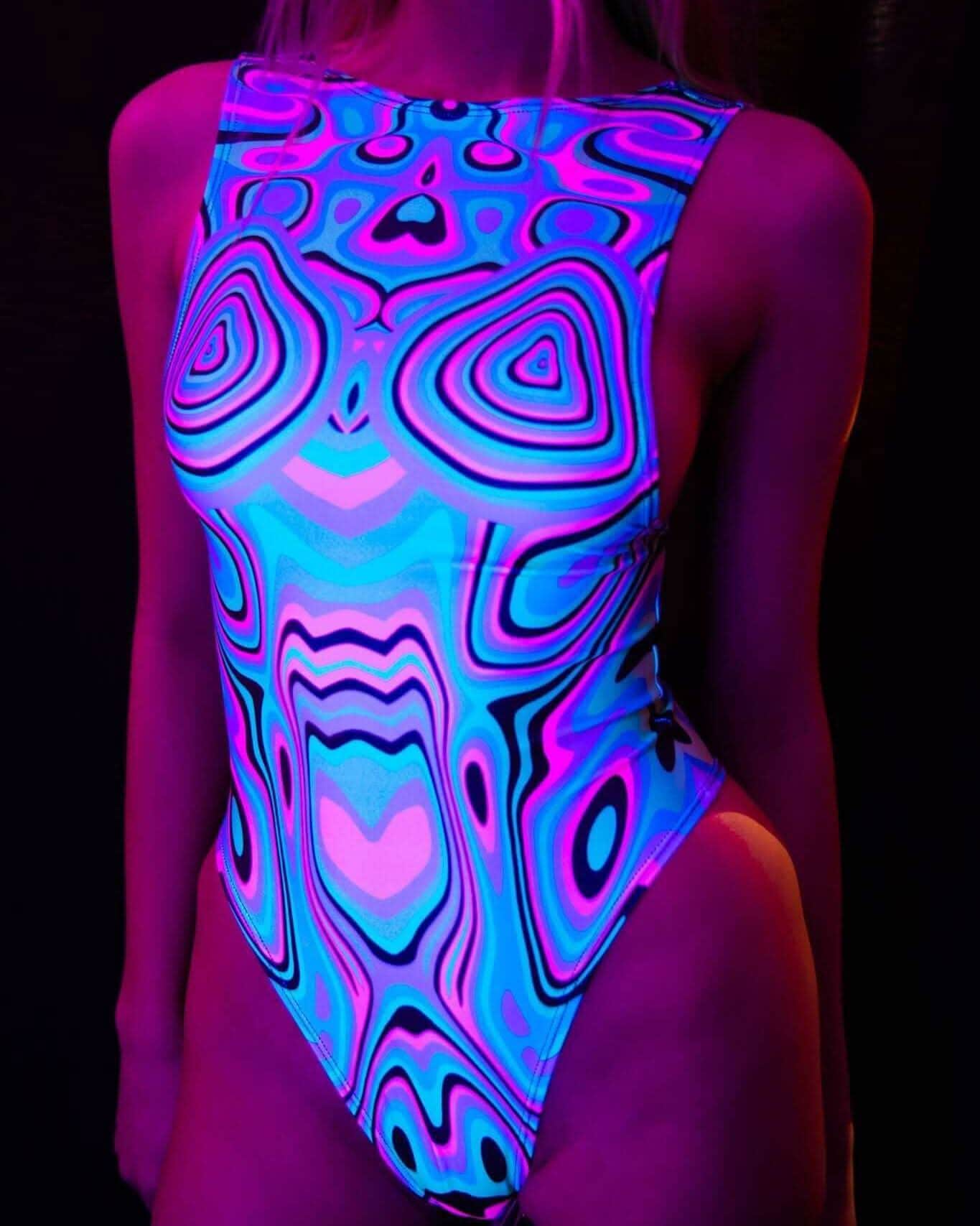 UV-reactive bodysuit with swirling blue and pink pattern glowing under blacklight